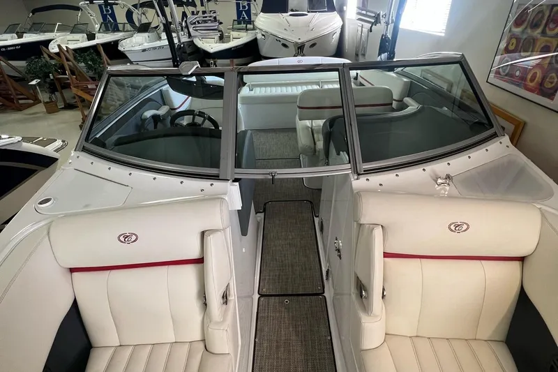 Slide: The Image of 2016 Cobalt R5 WSS boat interior with white seating and windshield. - 11