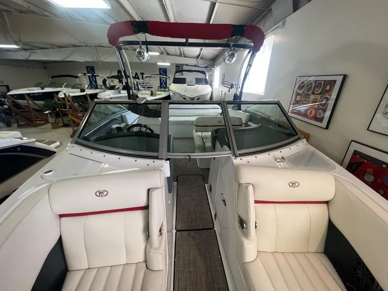 Slide: The Image of 2016 Cobalt R5 WSS boat interior with white leather seats in showroom. - 5