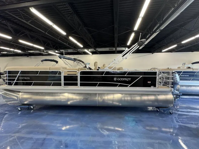 Slide: The Image of 2023 Godfrey SW 2486 SFL pontoon boat in showroom. - 0
