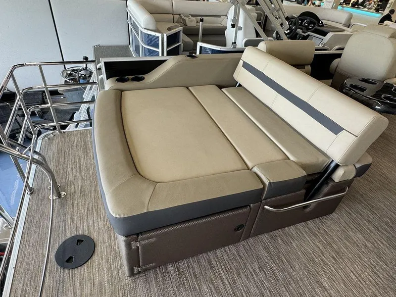 Slide: The Image of 2023 Godfrey SW 2486 SFL boat interior with beige and gray seating. - 11