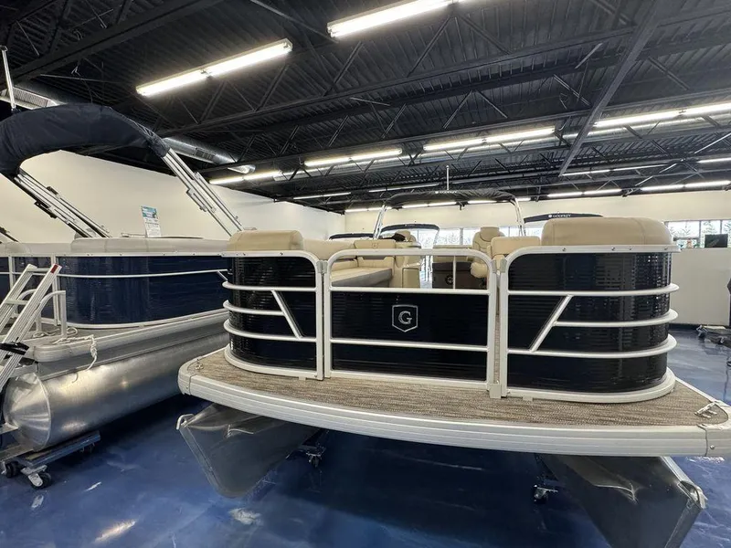 Slide: The Image of 2023 Godfrey SW 2486 SFL pontoon boat displayed in a showroom. - 3