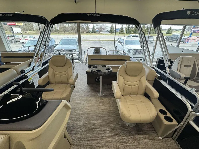 Slide: The Image of Interior of 2023 Godfrey SW 2486 SFL pontoon boat with beige seating. - 6