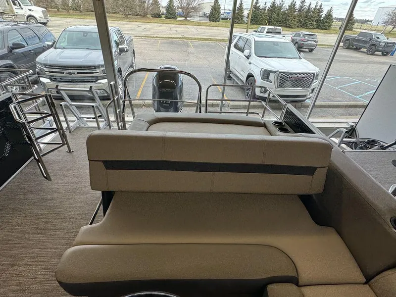 Slide: The Image of 2023 Godfrey SW 2486 SFL pontoon boat interior with rear seating and ladder. - 9