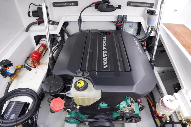 Slide: The Image of Engine compartment of a 2020 Novurania Chase boat featuring a Volvo Penta engine. - 17