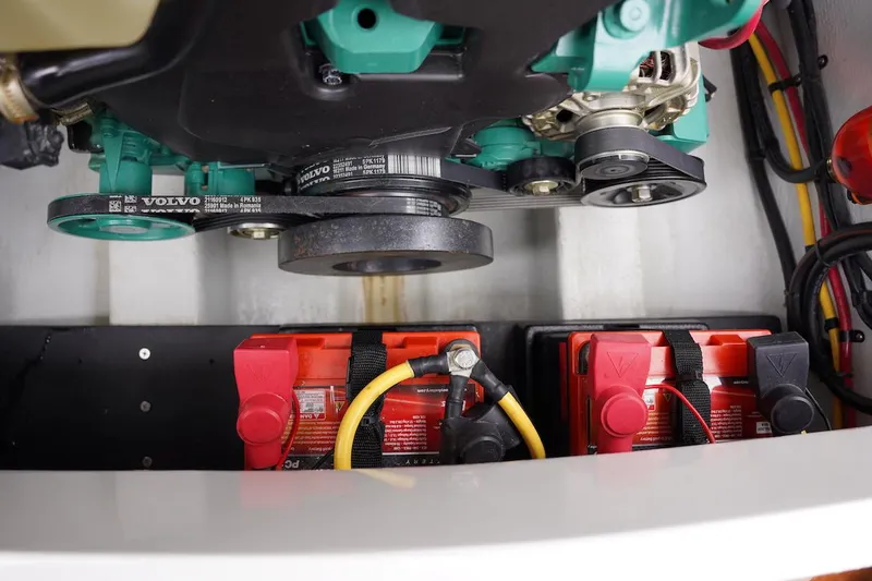 Slide: The Image of Engine compartment of a 2020 Novurania Chase boat with visible batteries and belts. - 21