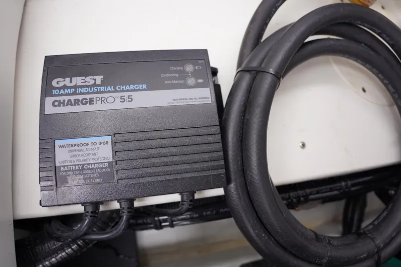 Slide: The Image of 10 Amp industrial charger in a 2020 Novurania Chase boat, waterproof design, ChargePro 55 model. - 23