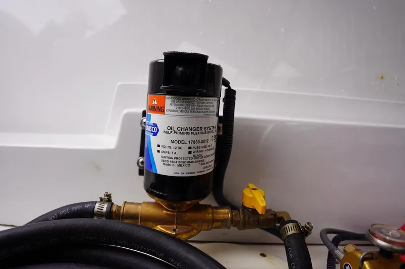 Slide: The Image of Oil changer system in 2020 Novurania Chase boat engine compartment. - 24