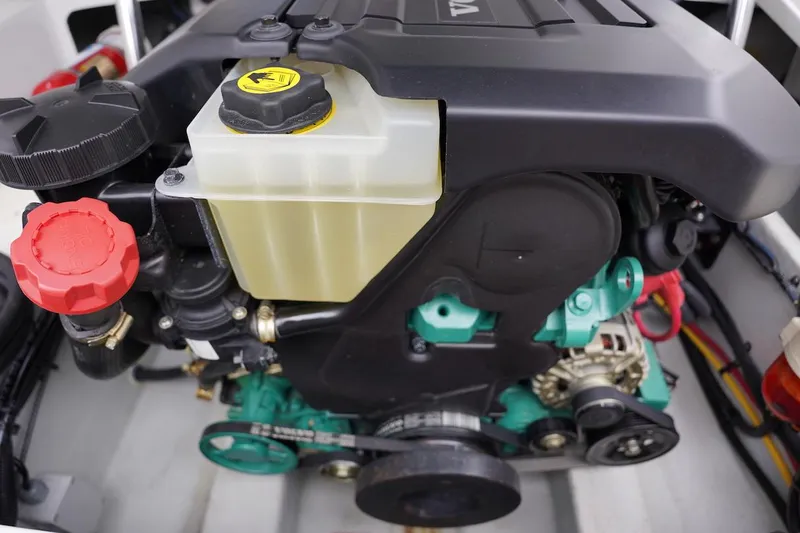 Slide: The Image of Engine compartment of a 2020 Novurania Chase boat, showcasing detailed components and fluid reservoirs. - 30