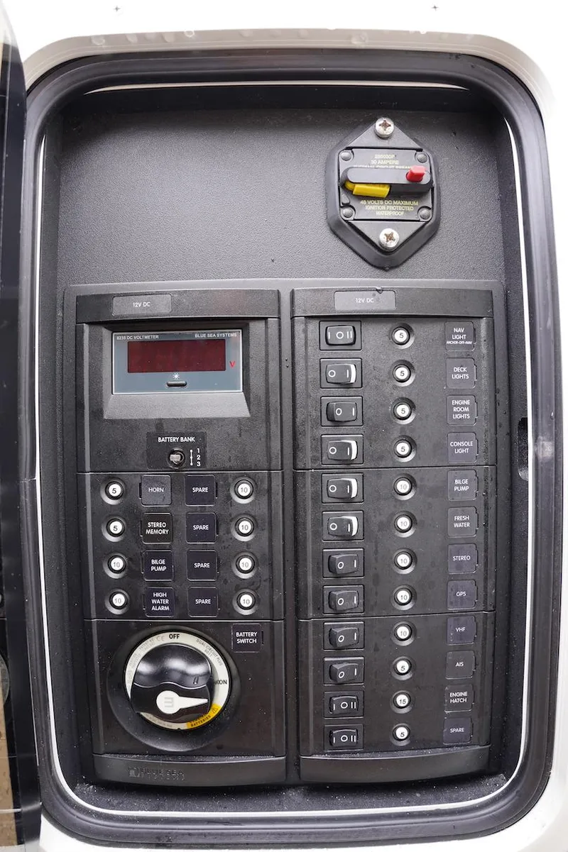 Slide: The Image of Control panel of a 2020 Novurania Chase boat with switches and display. - 35