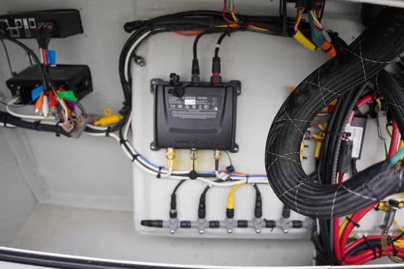 Slide: The Image of Electrical system inside a 2020 Novurania Chase boat, featuring wiring and components. - 42