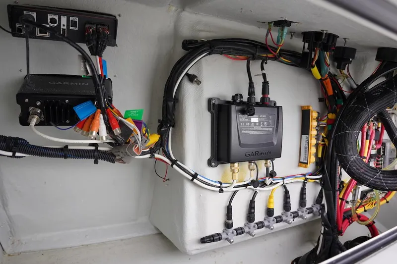 Slide: The Image of Electrical wiring and components inside a 2020 Novurania Chase boat. - 44