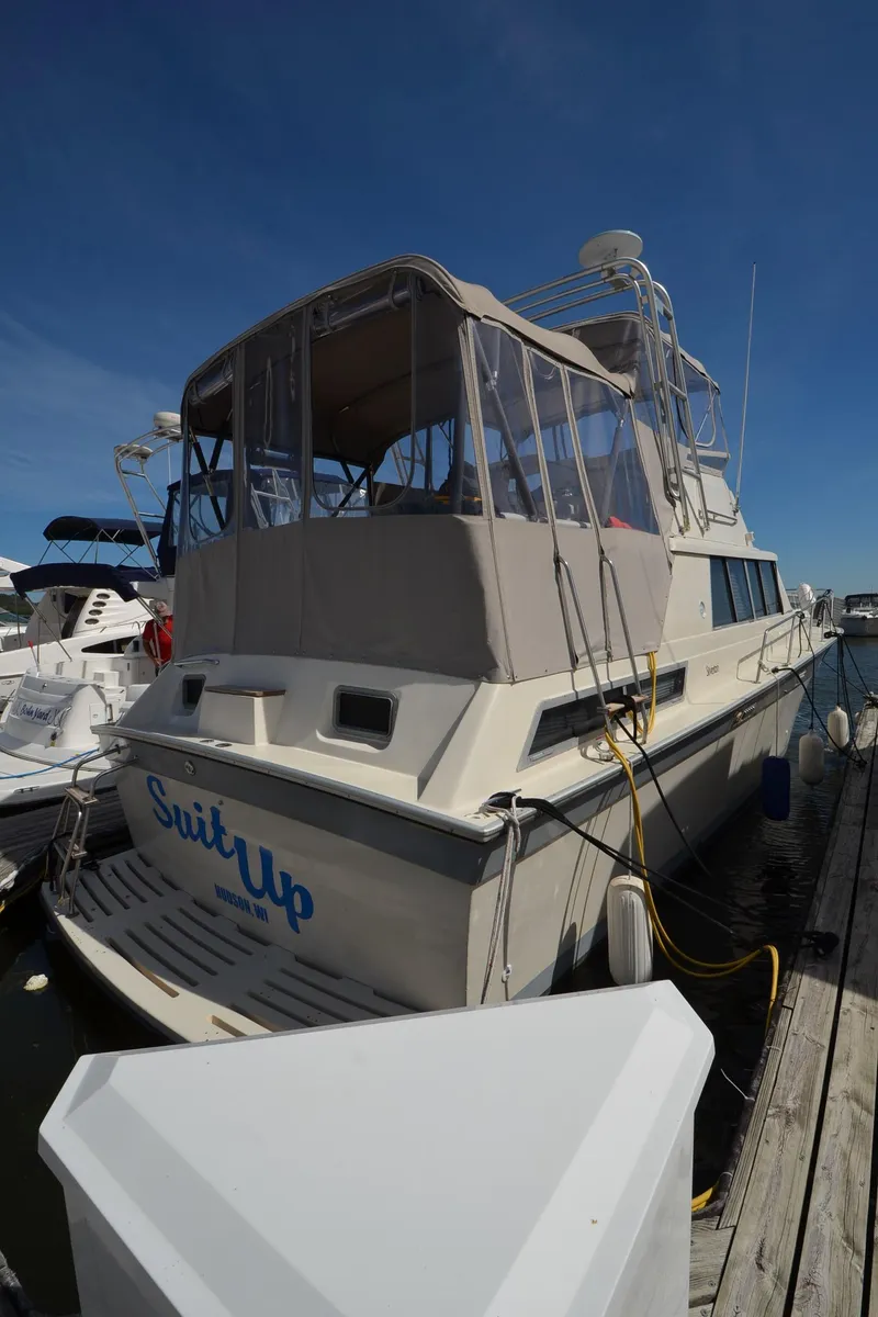 Slide: The Image of 1986 Silverton 40 Aft Cabin boat docked at marina. - 29