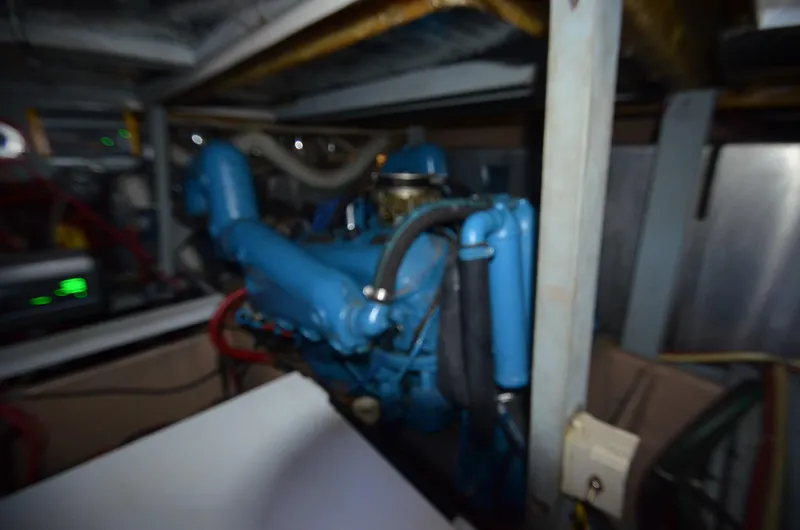 Slide: The Image of 1986 Silverton 40 Aft Cabin engine compartment with blue engine. - 34