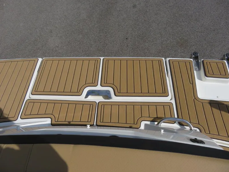 Slide: The Image of 2022 Sea Ray 21 SPX boat deck with teak-style flooring. - 2