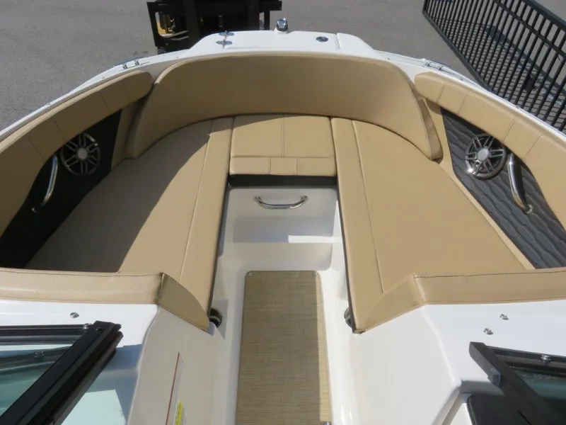 Slide: The Image of 2022 Sea Ray 21 SPX boat interior with beige seating and modern design. - 3