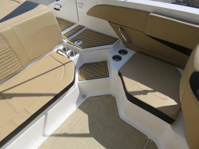 Slide: The Image of 2022 Sea Ray 21 SPX boat interior with tan seating and cup holders. - 7