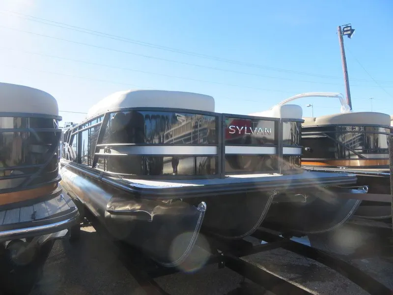 Slide: The Image of 2023 Sylvan Mirage X5 pontoon boat in a marina. - 1