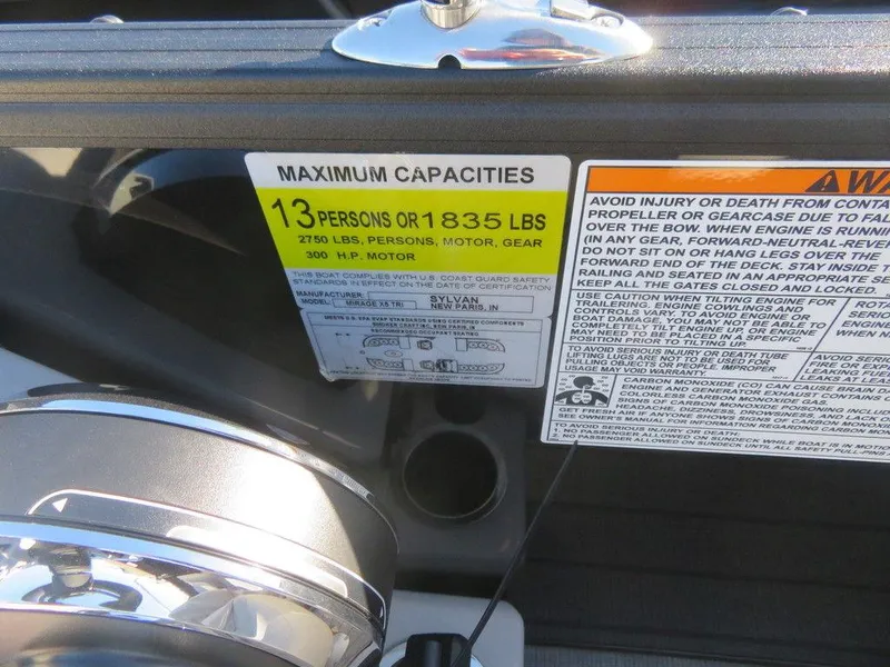 Slide: The Image of 2023 Sylvan Mirage X5 capacity label showing maximum capacities and safety warnings. - 13