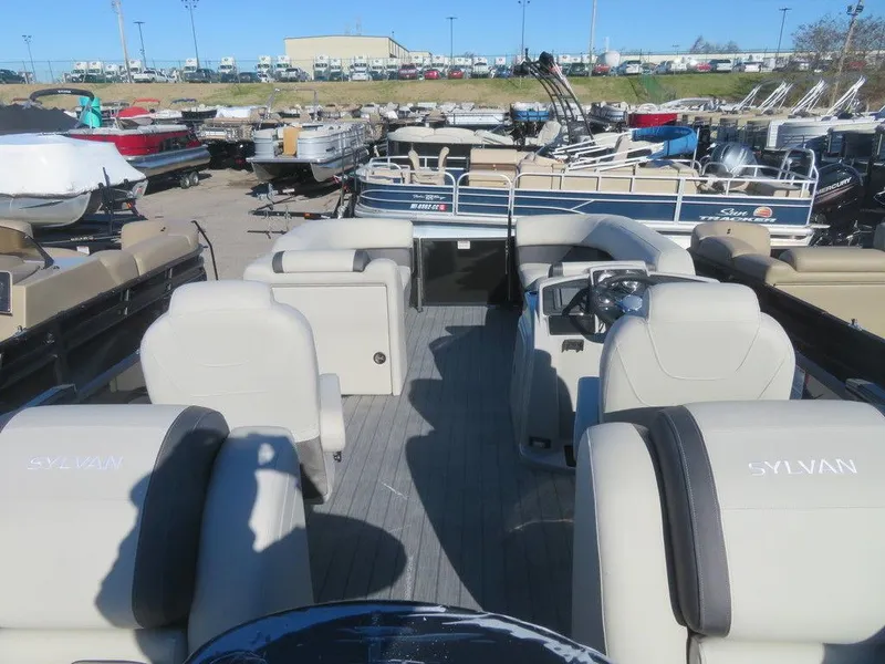 Slide: The Image of 2023 Sylvan Mirage X5 pontoon boat interior at a dealership. - 17