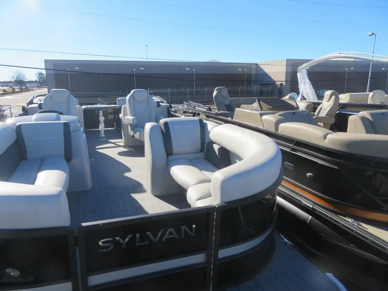 Slide: The Image of 2023 Sylvan Mirage X5 pontoon boat with spacious seating and modern design. - 3