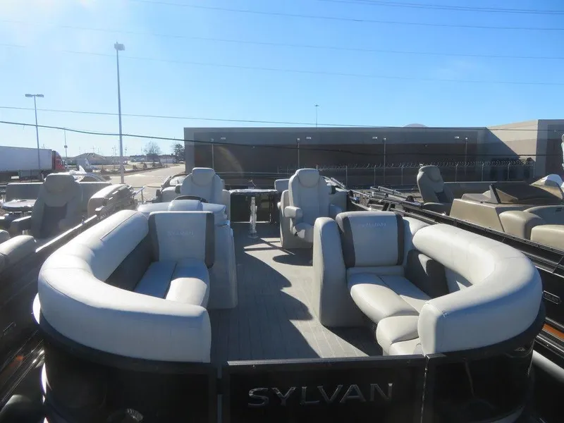 Slide: The Image of 2023 Sylvan Mirage X5 pontoon boat with spacious seating and modern design. - 6