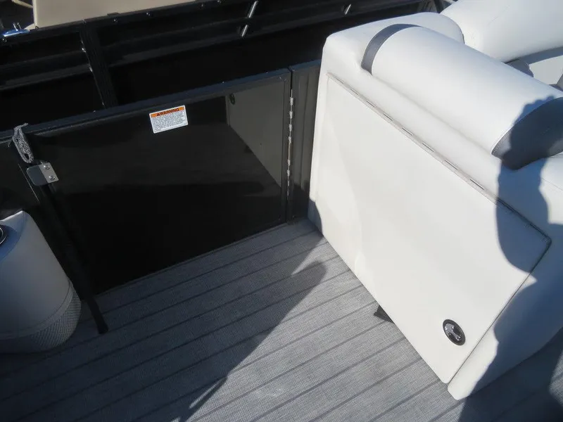 Slide: The Image of 2023 Sylvan Mirage X5 boat interior with seating and gate. - 8