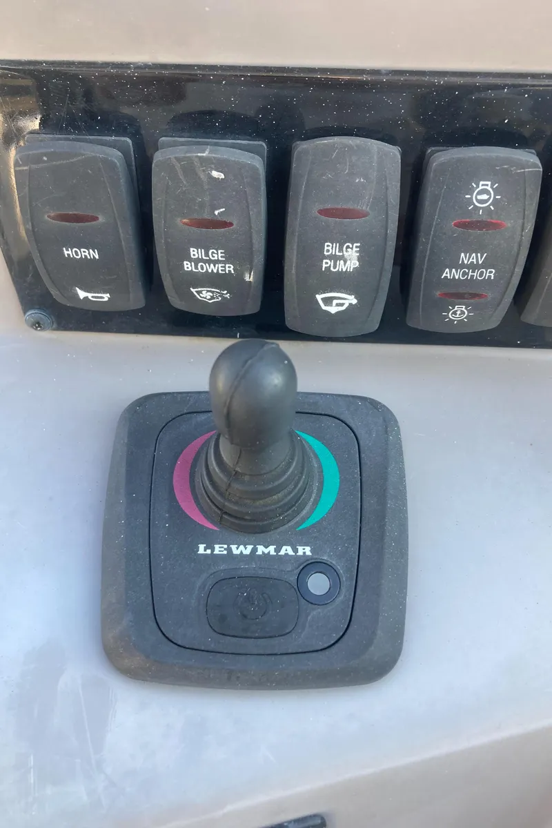Slide: The Image of Control panel of a 2015 Regal 28 Express boat with Lewmar joystick. - 11