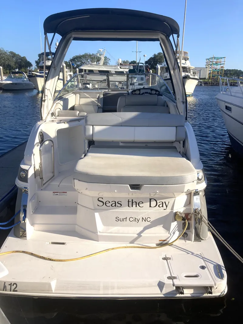 Slide: The Image of 2015 Regal 28 Express boat docked, named Seas the Day, Surf City, NC. - 2
