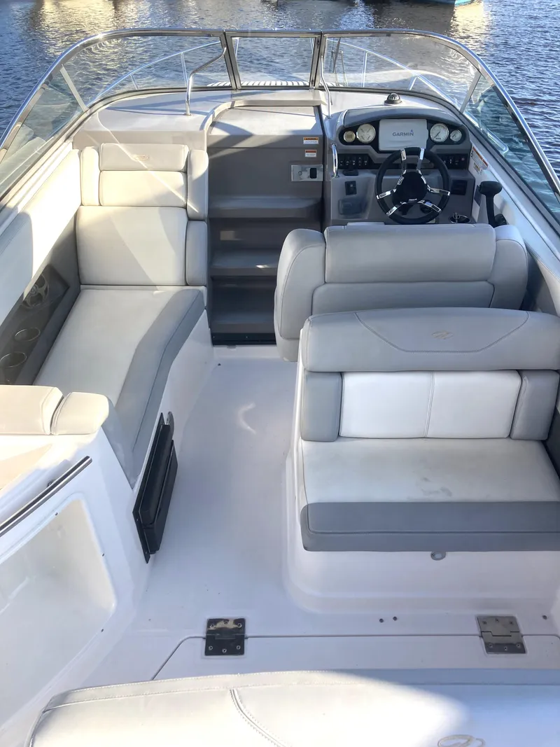 Slide: The Image of 2015 Regal 28 Express boat interior with seating and steering console. - 5