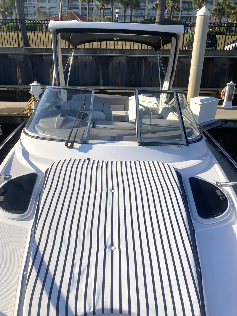 Slide: The Image of 2015 Regal 28 Express boat docked at marina. - 7