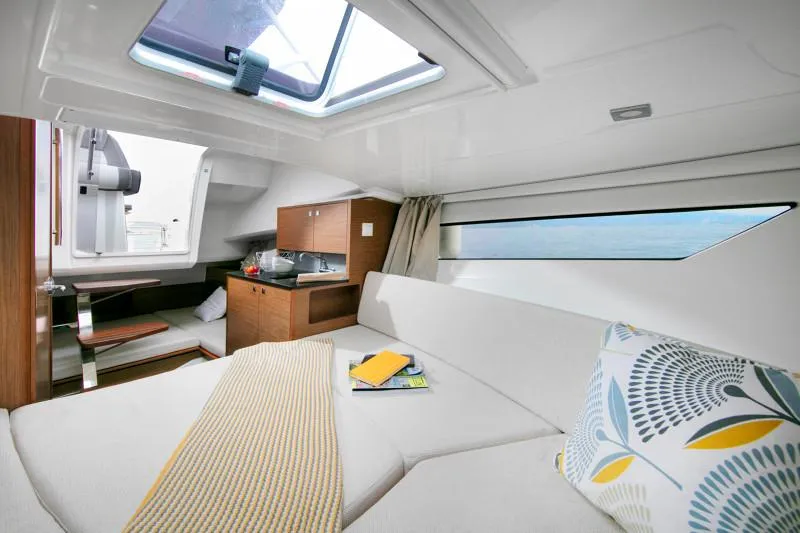 Slide: The Image of Interior of 2025 Jeanneau Leader 9.0 WA S2, featuring cozy cabin and modern amenities. - 13