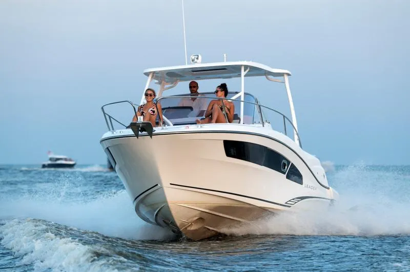 Slide: The Image of 2025 Jeanneau Leader 9.0 WA S2 cruising on open water with passengers. - 5