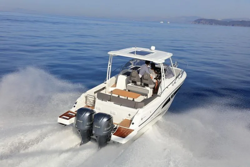 Slide: The Image of 2025 Jeanneau Leader 9.0 WA S2 cruising on open water, rear view. - 8