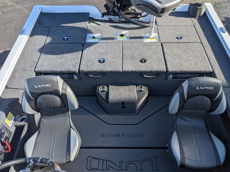 Slide: The Image of 2025 Lund 1875 Pro V Bass boat interior with seating and storage compartments. - 5