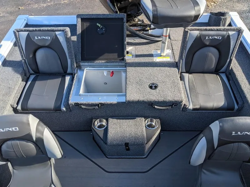 Slide: The Image of 2025 Lund 1875 Pro V Bass boat interior with seating and storage compartments. - 6
