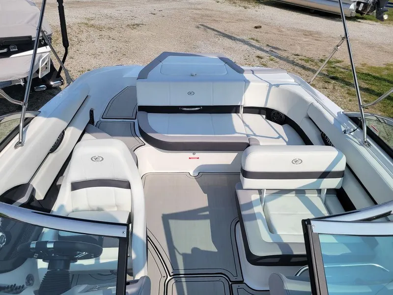 Slide: The Image of 2024 Cobalt CS22 boat interior with white and gray seating. - 13