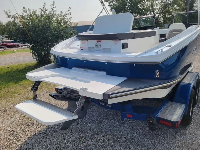 Slide: The Image of 2024 Cobalt CS22 boat with extended swim platform and trailer. - 16