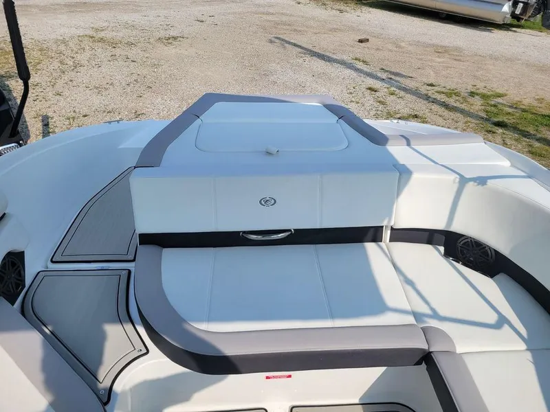 Slide: The Image of 2024 Cobalt CS22 boat interior with white and gray seating. - 8