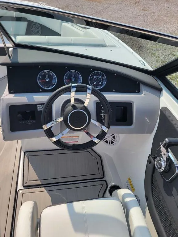 Slide: The Image of 2024 Cobalt CS22 boat dashboard with steering wheel and gauges. - 9