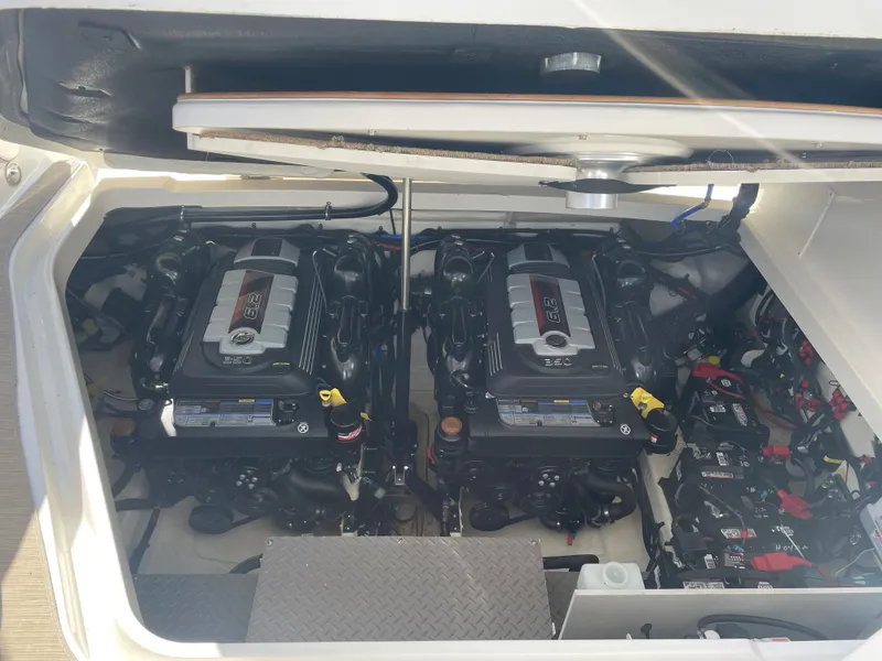 Slide: The Image of The engine compartment of a 2020 Sea Ray Sundancer 320 features two powerful engines. - 37