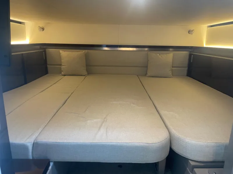 Slide: The Image of Interior view of a 2020 Sea Ray Sundancer 320 featuring a spacious sleeping area. - 31
