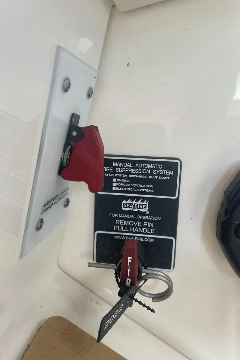 Slide: The Image of A fire suppression system with a red handle and safety pin is visible. - 16