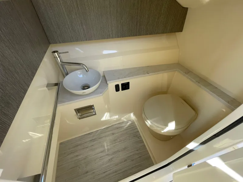 Slide: The Image of 2024 Scout 277 Dorado boat bathroom with modern sink and toilet. - 13
