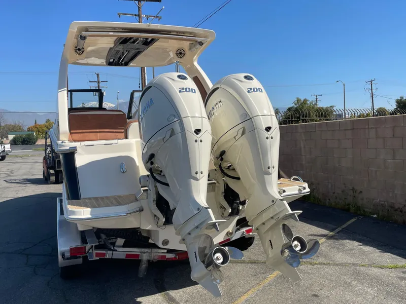 Slide: The Image of 2024 Scout 277 Dorado boat with twin 200 horsepower outboard engines. - 2