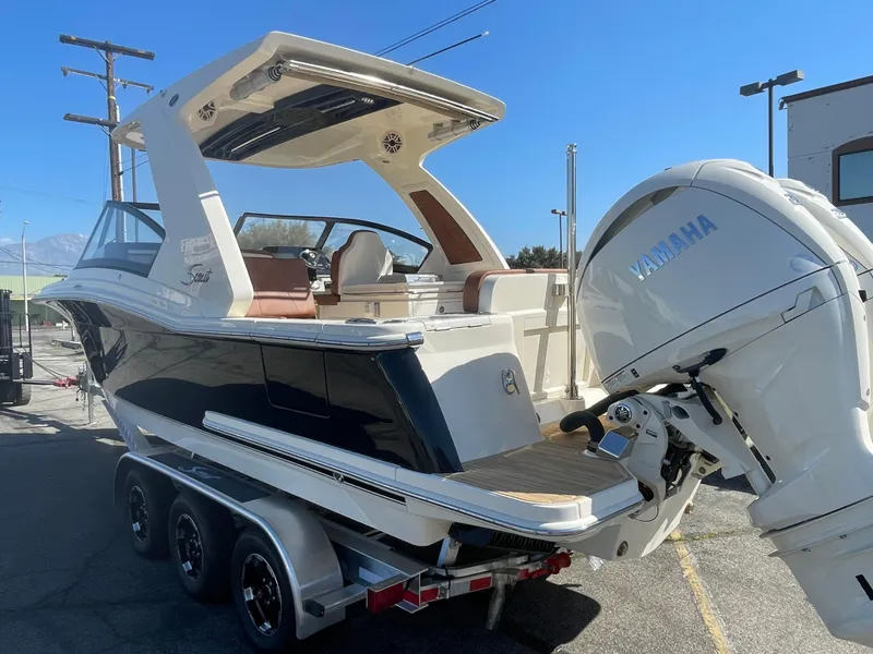 Slide: The Image of 2024 Scout 277 Dorado boat on trailer with Yamaha outboard motor. - 3