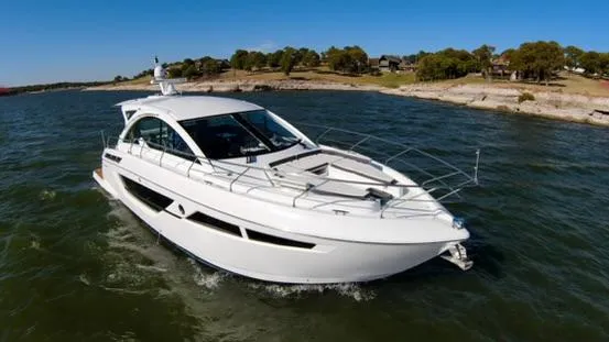 Slide: The Image of 2018 Cruisers Yachts 50 Cantius luxury motor yacht cruising on a lake. - 0