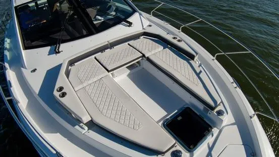 Slide: The Image of 2018 Cruisers Yachts 50 Cantius bow deck with cushioned seating. - 11
