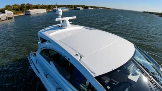 Slide: The Image of 2018 Cruisers Yachts 50 Cantius on the water, top view. - 12