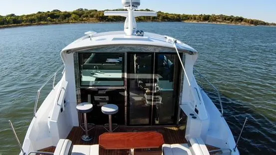 Slide: The Image of 2018 Cruisers Yachts 50 Cantius on a serene lake. - 14