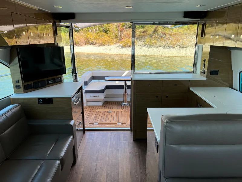 Slide: The Image of Interior of 2018 Cruisers Yachts 50 Cantius with modern furnishings and water view. - 16